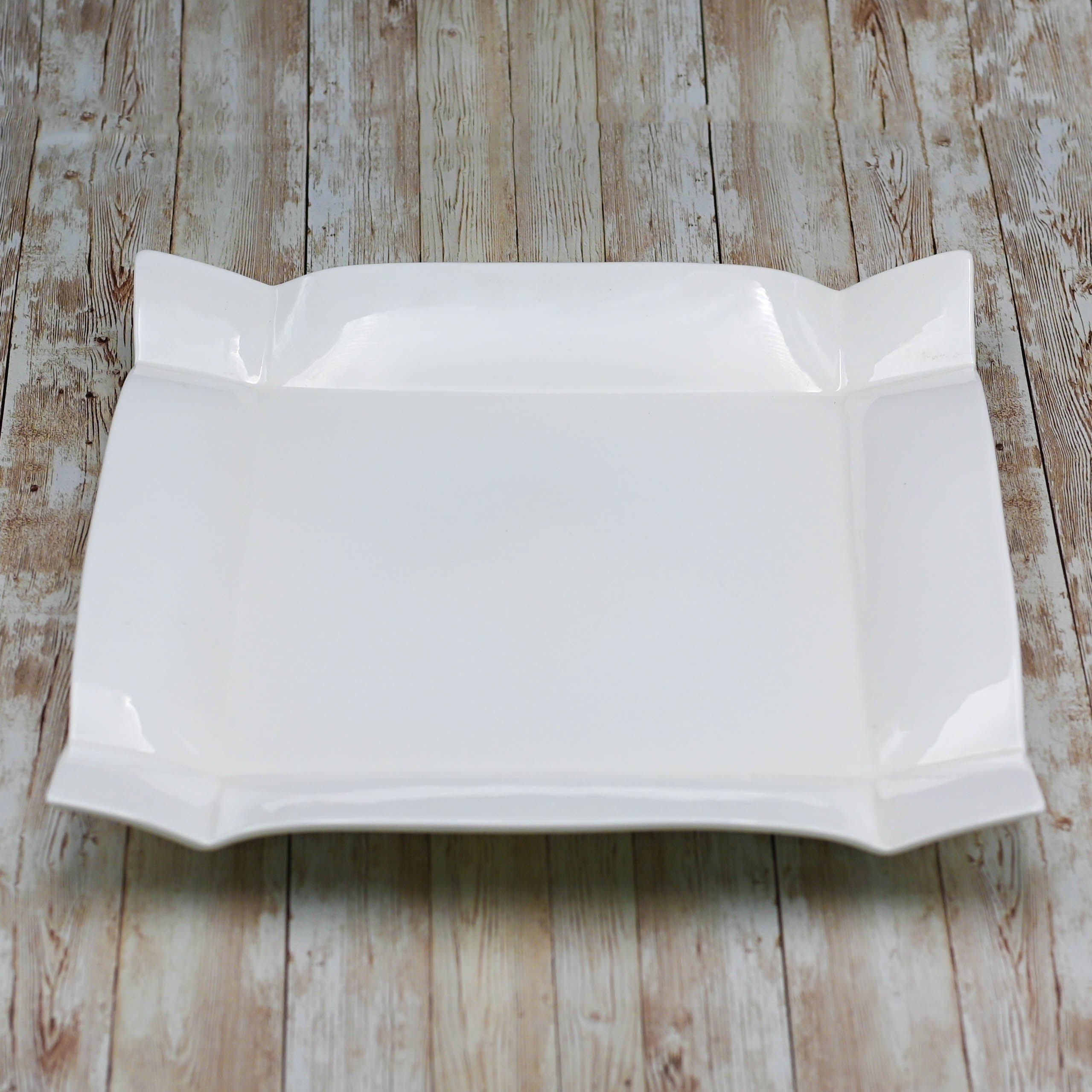 Wilmax White Square Platter measuring 11.5 inches, elegantly designed for serving various dishes.