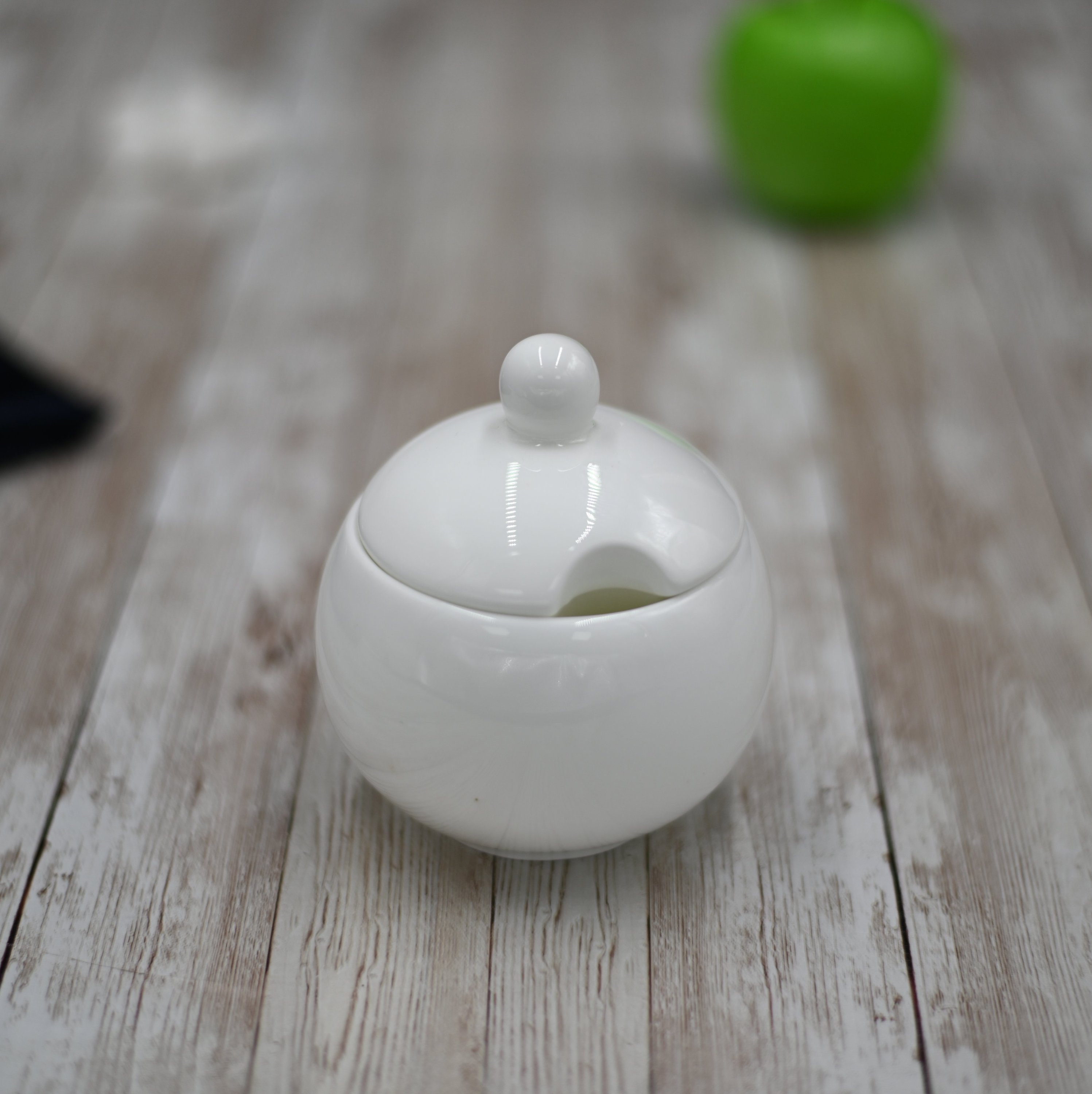 Wilmax White Sugar Bowl, 11 oz, round with lid, made of durable porcelain, featuring a glossy white glaze.