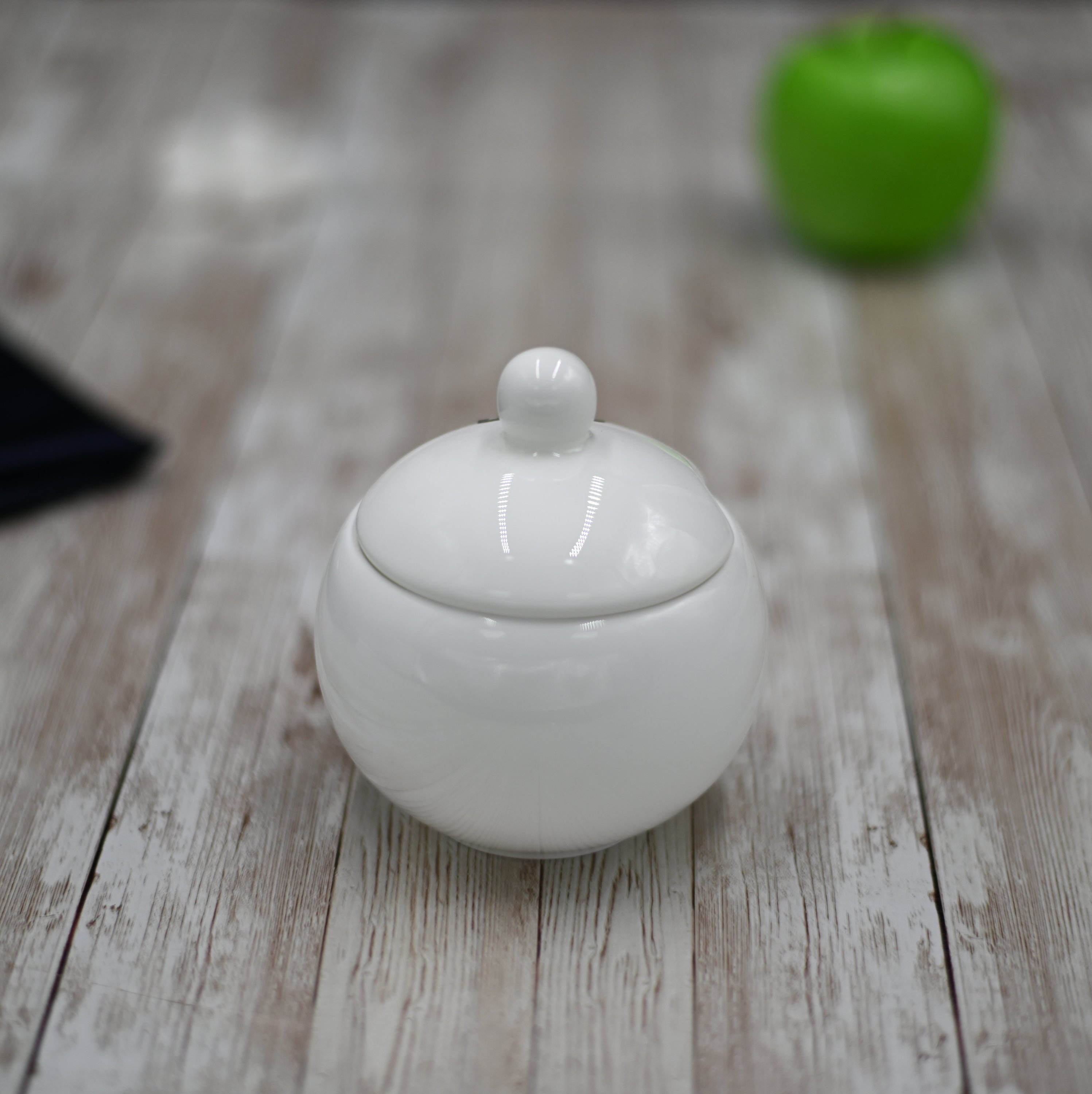 Wilmax White Sugar Bowl, 11 oz, round with lid, made of durable porcelain, featuring a glossy white glaze.