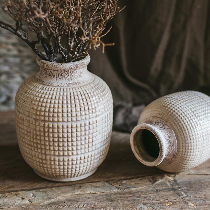 A beautifully handcrafted white textured porcelain ceramic jar vase, showcasing a unique design and elegant finish.