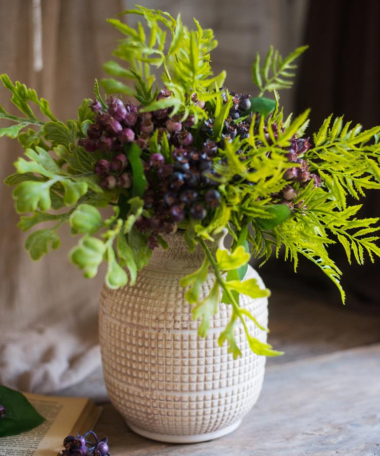 A beautifully handcrafted white textured porcelain ceramic jar vase, showcasing a unique design and elegant finish.