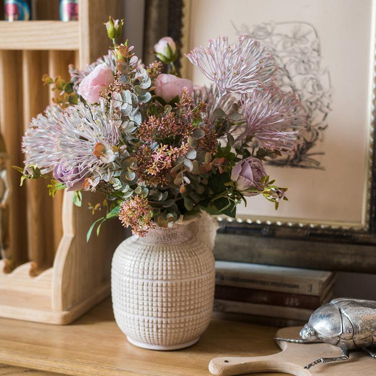 A beautifully handcrafted white textured porcelain ceramic jar vase, showcasing a unique design and elegant finish.