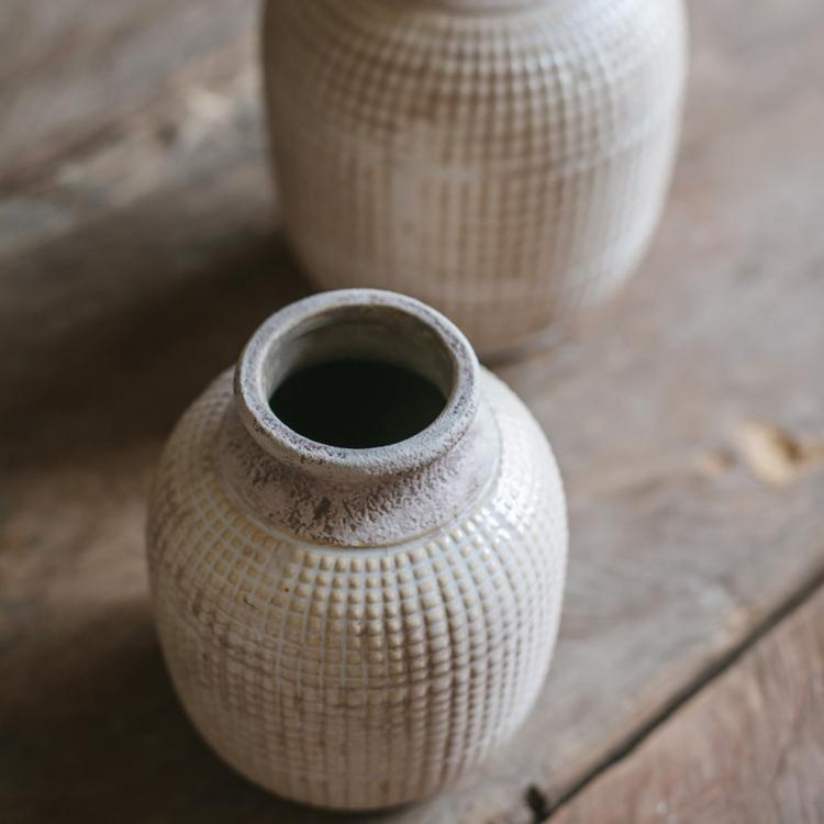 A beautifully handcrafted white textured porcelain ceramic jar vase, showcasing a unique design and elegant finish.