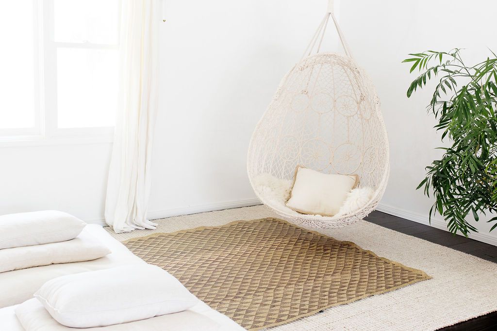 A beautifully crafted White Triangle Mat, 6' x 5', showcasing intricate patterns made from natural fibers, perfect for indoor and outdoor use.