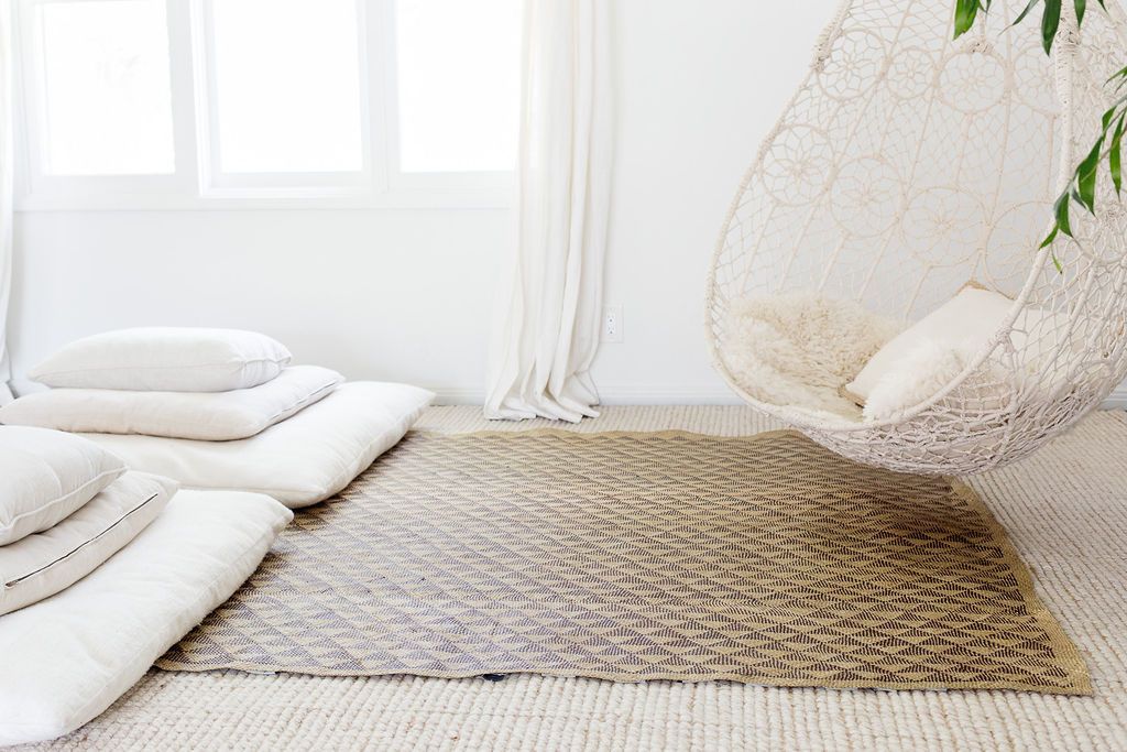 A beautifully crafted White Triangle Mat, 6' x 5', showcasing intricate patterns made from natural fibers, perfect for indoor and outdoor use.