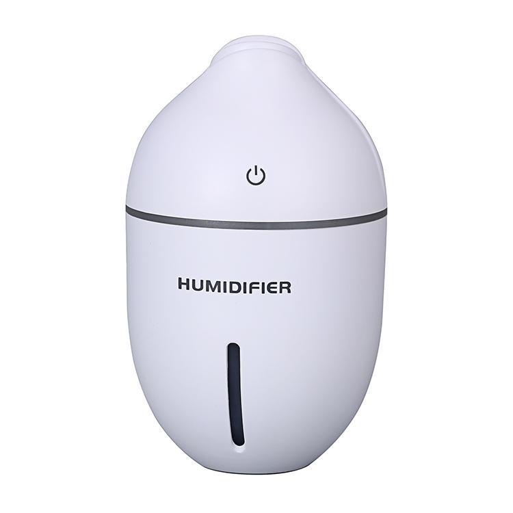 A compact 300ml USB Ultrasonic Humidifier in light brown, designed for essential oil diffusion and air humidification.