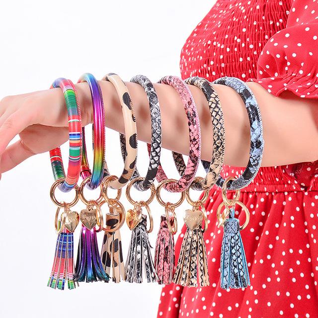 Colorful PU leather O bracelet keychains displayed in various colors, showcasing their stylish design and charm.