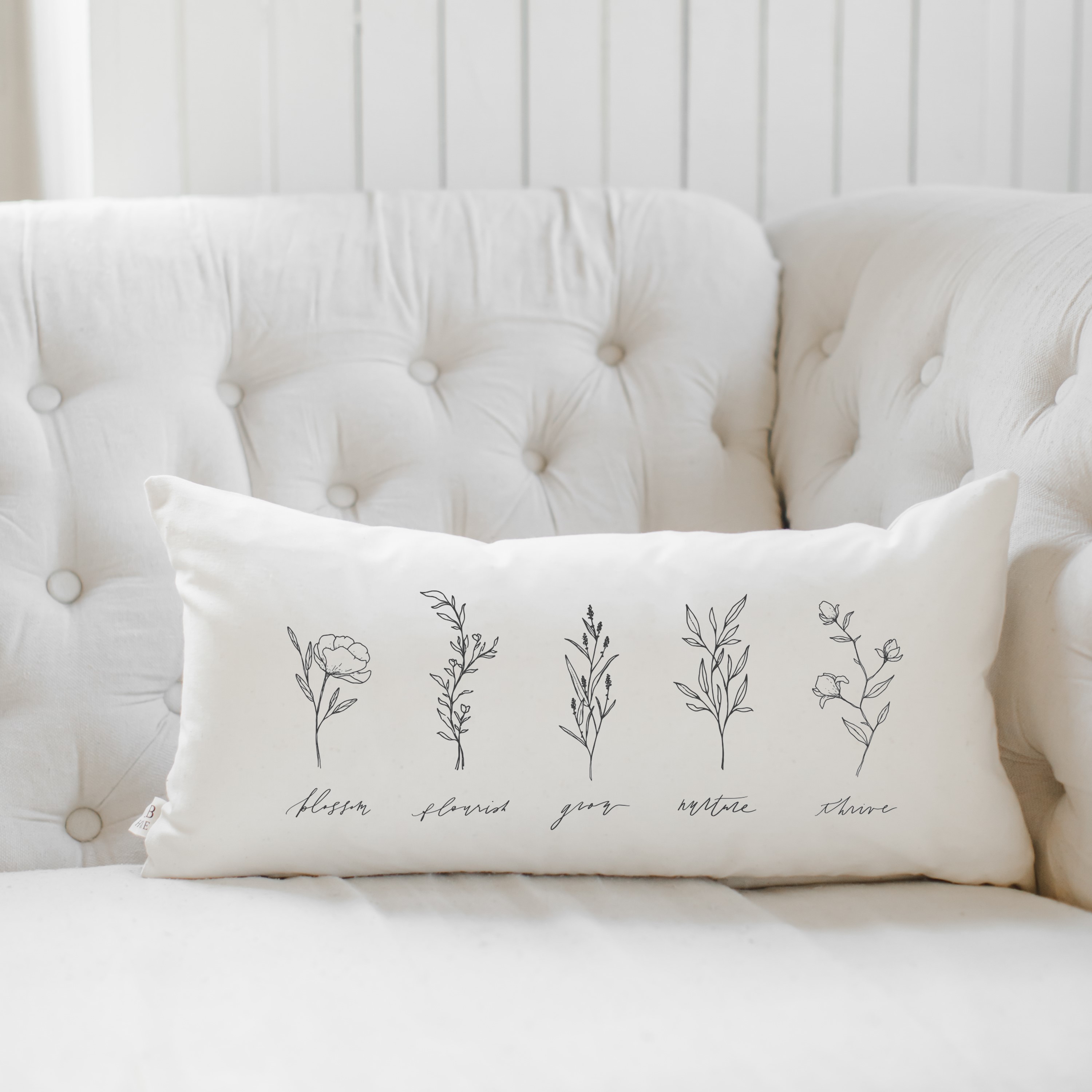 Wildflowers Lumbar Pillow featuring elegant calligraphy on a neutral background, perfect for home decor.