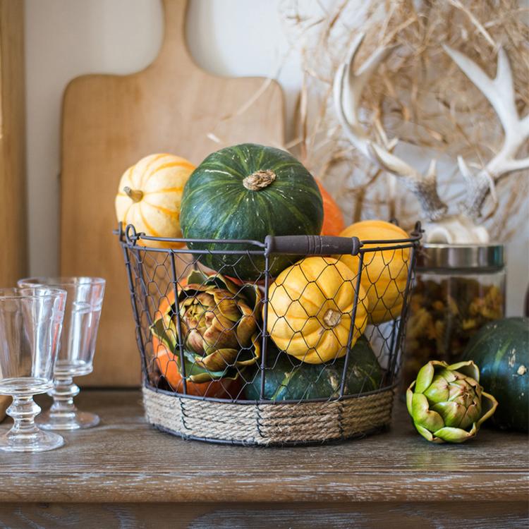 Wire Carry Basket with Hemp Rope Bottom, featuring a sturdy metal frame and natural hemp base, available in various colors.