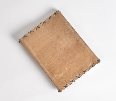 A beautifully handcrafted Wire Stitched Leather Diary with a vintage brown leather exterior and handmade paper pages, featuring a leather loop for holding pens.