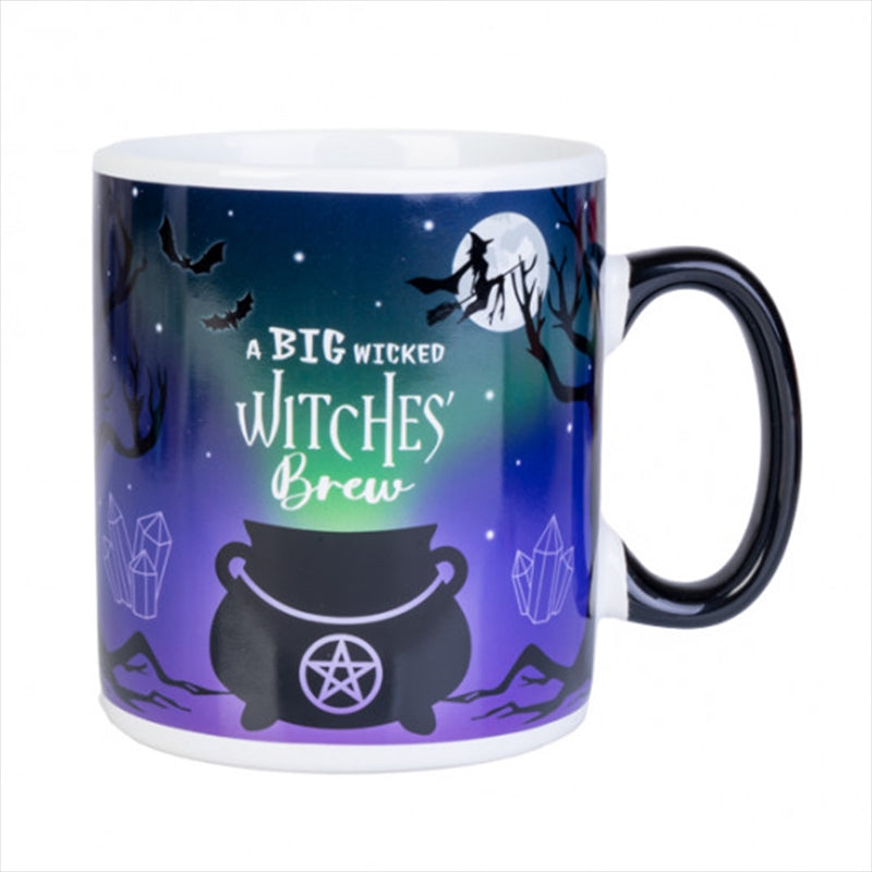 A large ceramic mug featuring a mystical landscape with a silhouetted cauldron and witch, perfect for coffee lovers.