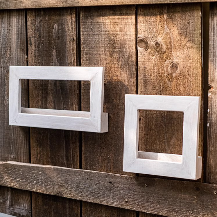 Wood Hanging Floral Frame in white, showcasing plants elegantly on a wall.