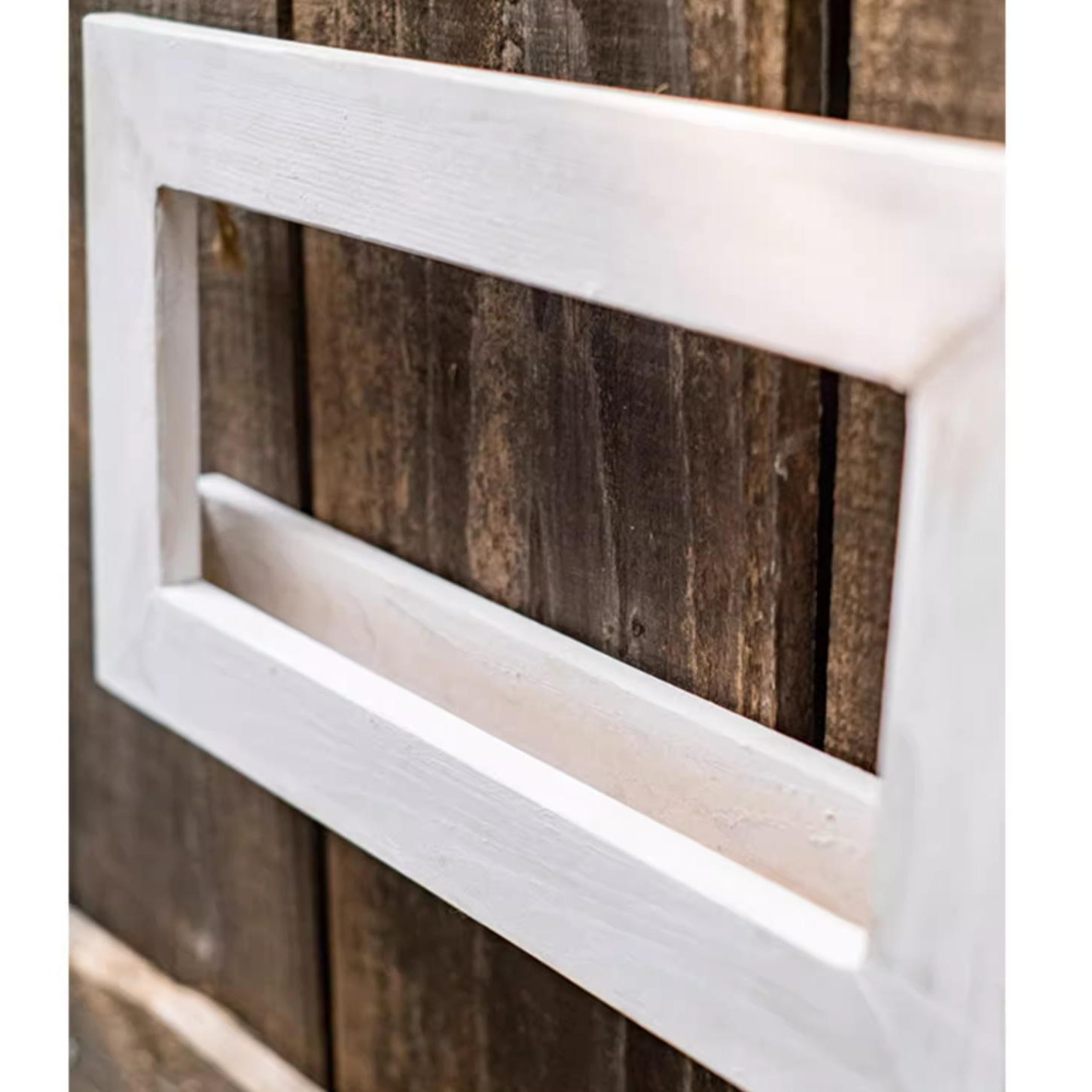 Wood Hanging Floral Frame in white, showcasing plants elegantly on a wall.