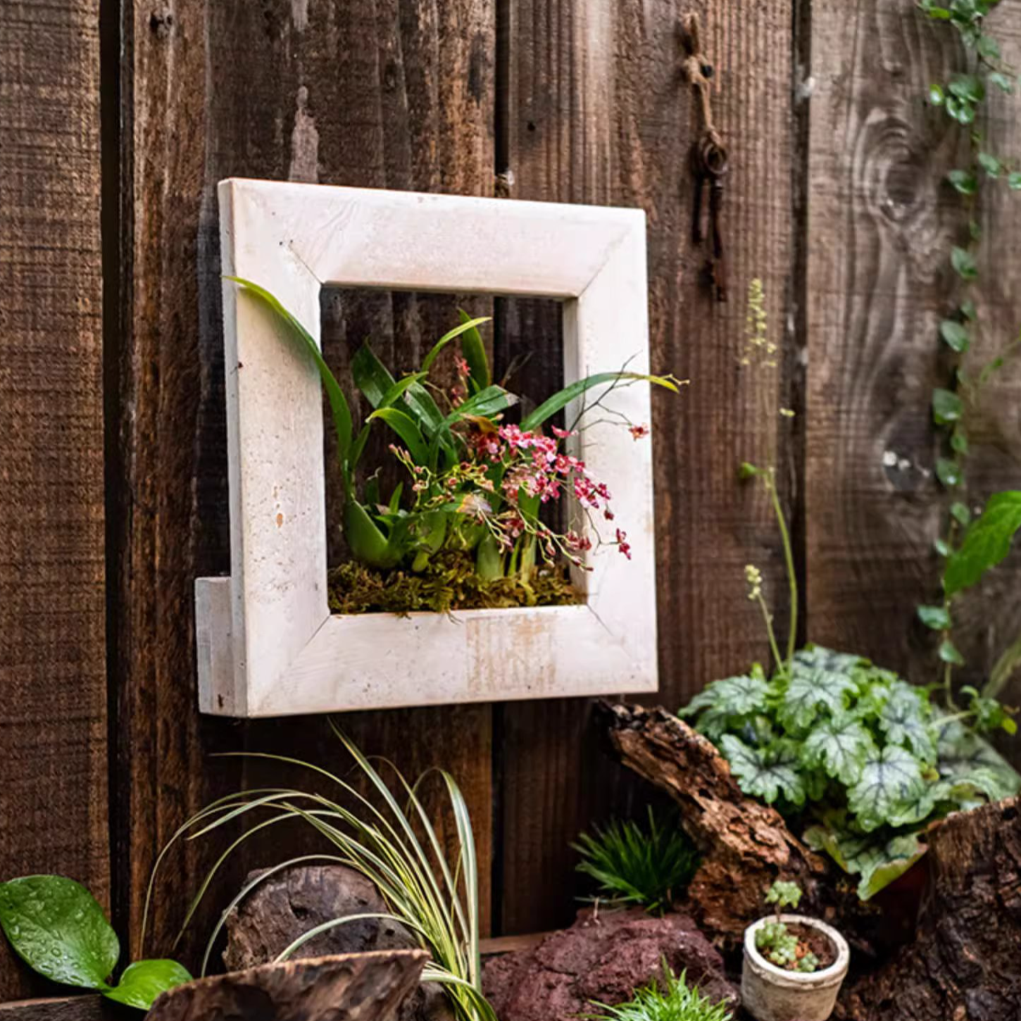 Wood Hanging Floral Frame in white, showcasing plants elegantly on a wall.