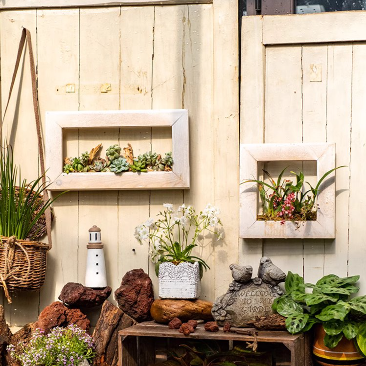 Wood Hanging Floral Frame in white, showcasing plants elegantly on a wall.