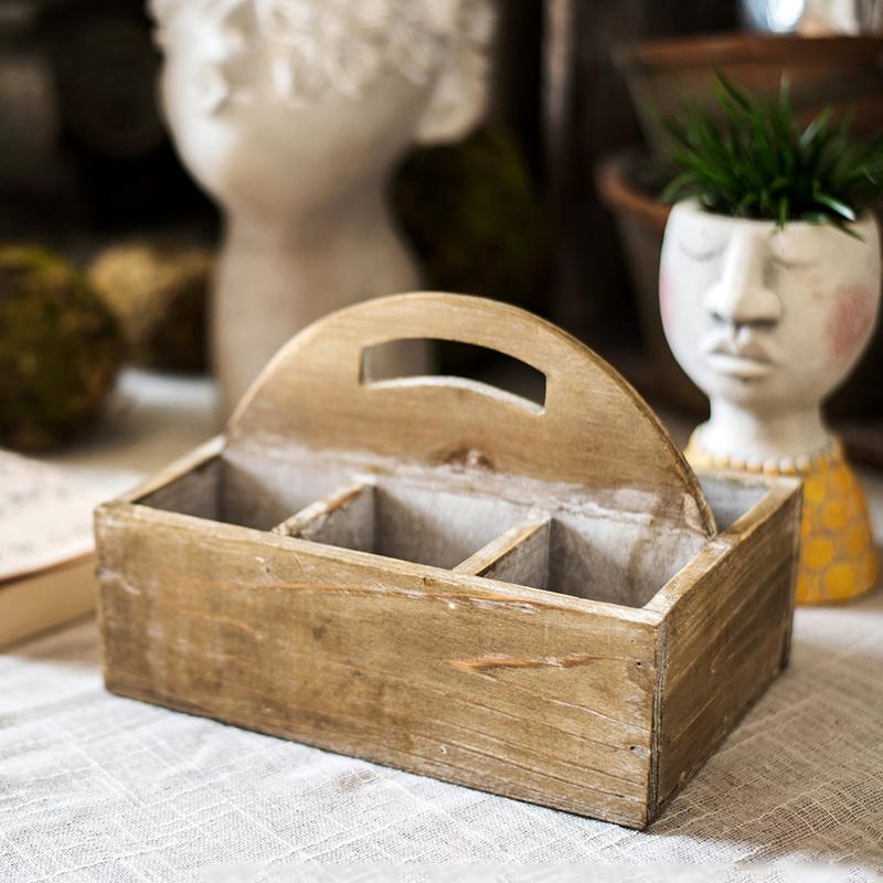 A stylish wooden box basket with a carry handle, showcasing its natural wood finish and versatile design for home organization.