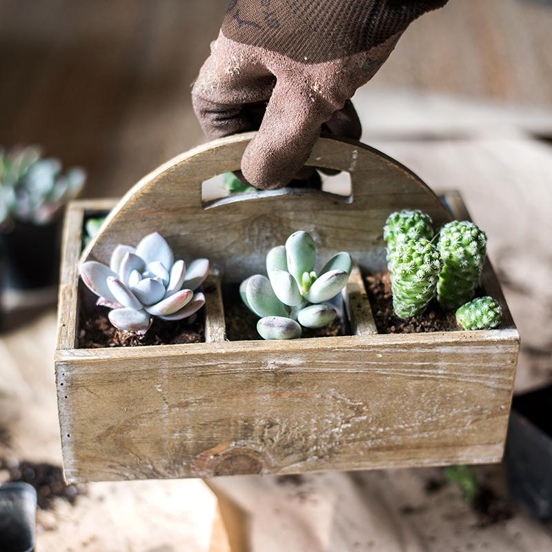 A stylish wooden box basket with a carry handle, showcasing its natural wood finish and versatile design for home organization.