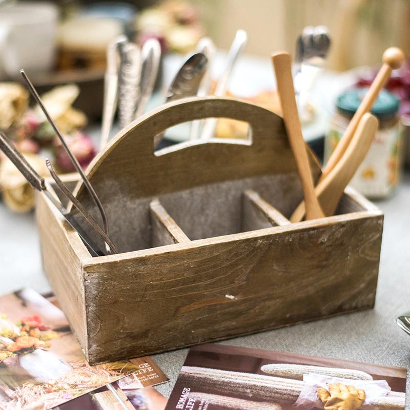 A stylish wooden box basket with a carry handle, showcasing its natural wood finish and versatile design for home organization.