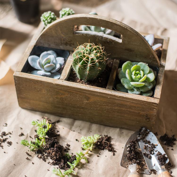 A stylish wooden box basket with a carry handle, showcasing its natural wood finish and versatile design for home organization.