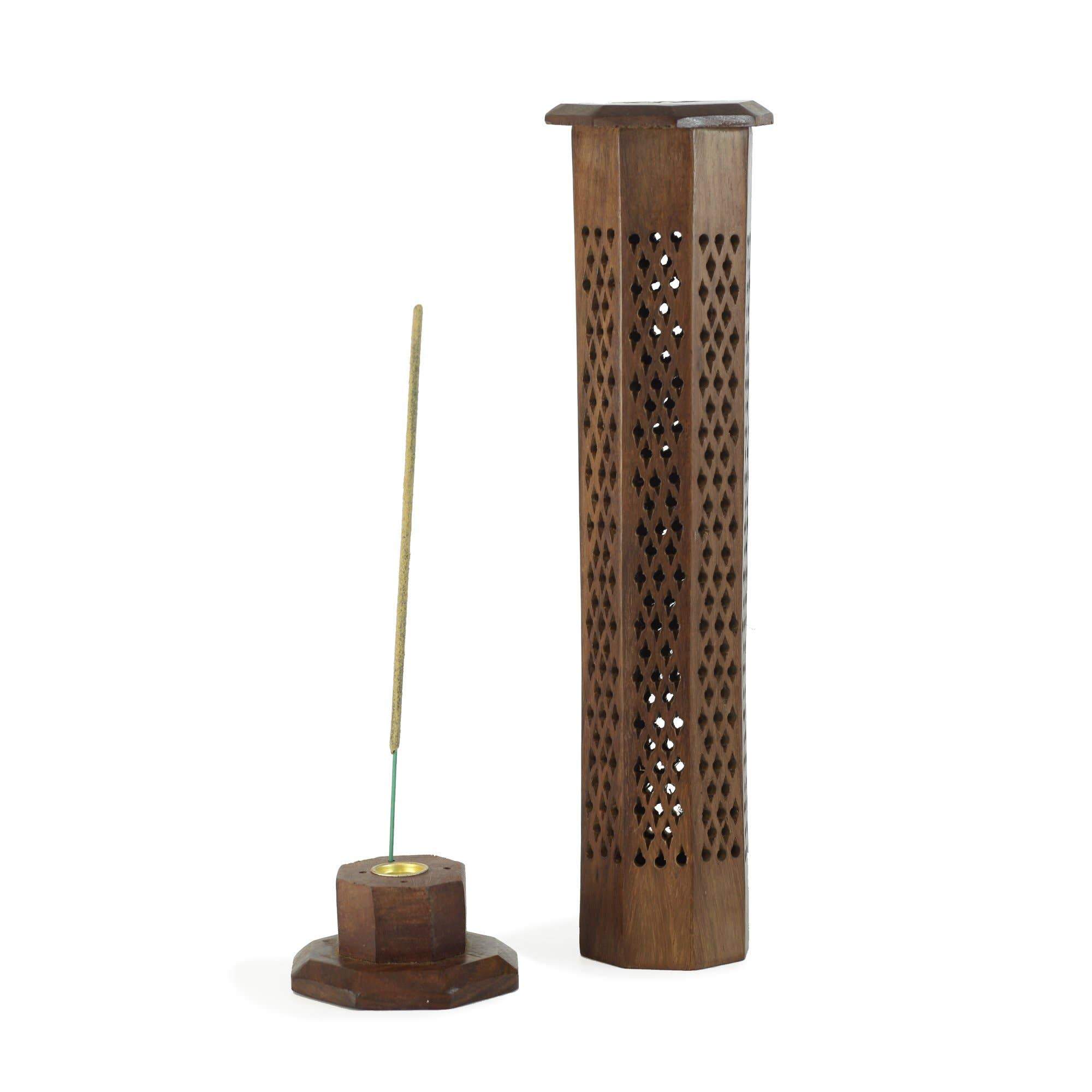 Handcarved wooden incense burner in octagon tower shape with floral designs, made from Sheesham wood, showcasing smoke openings.