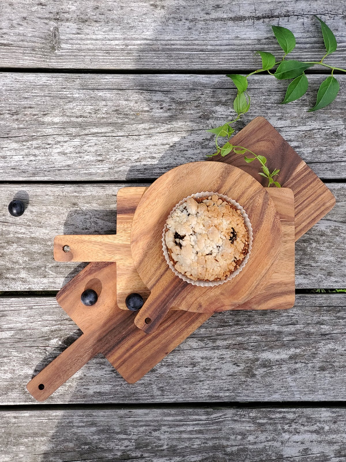 Large handcrafted wooden serving board made from Albizia hardwood, showcasing unique grain patterns and natural finish.