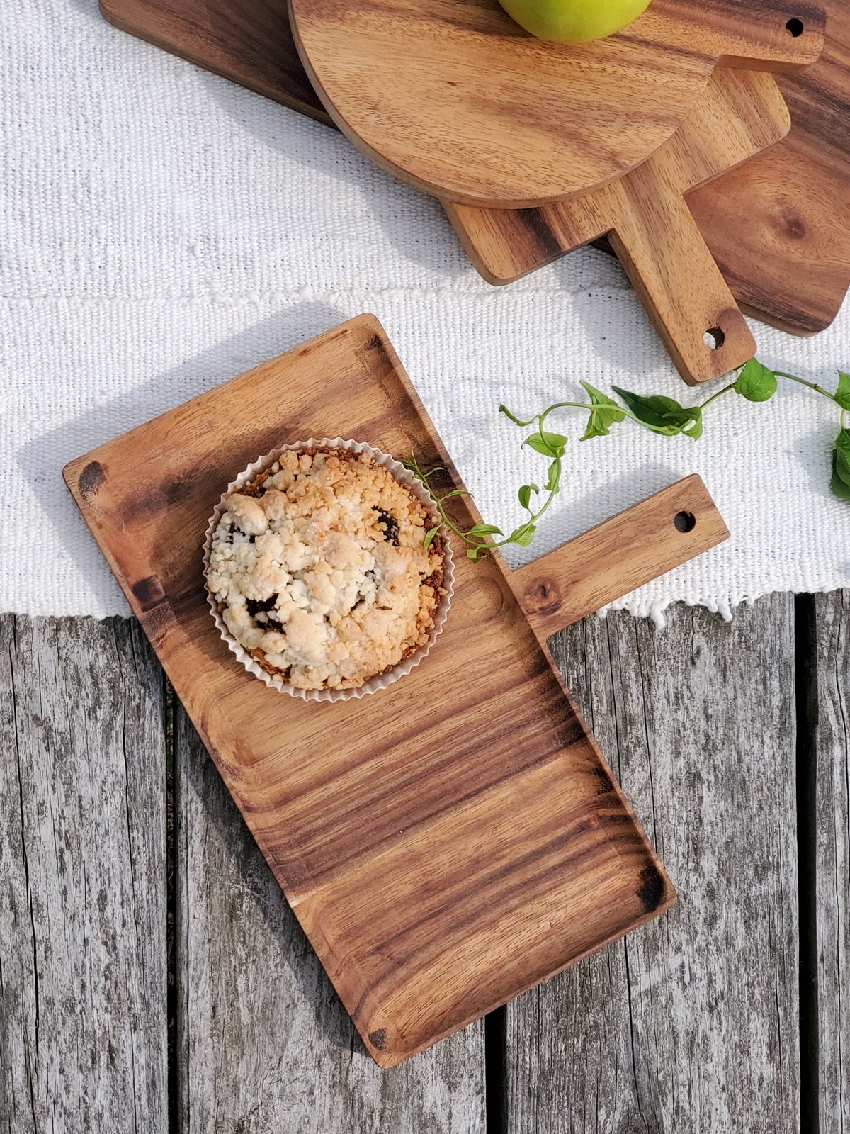 Handcrafted wooden serving tray made from Albizia hardwood, showcasing unique grain patterns and natural finish.