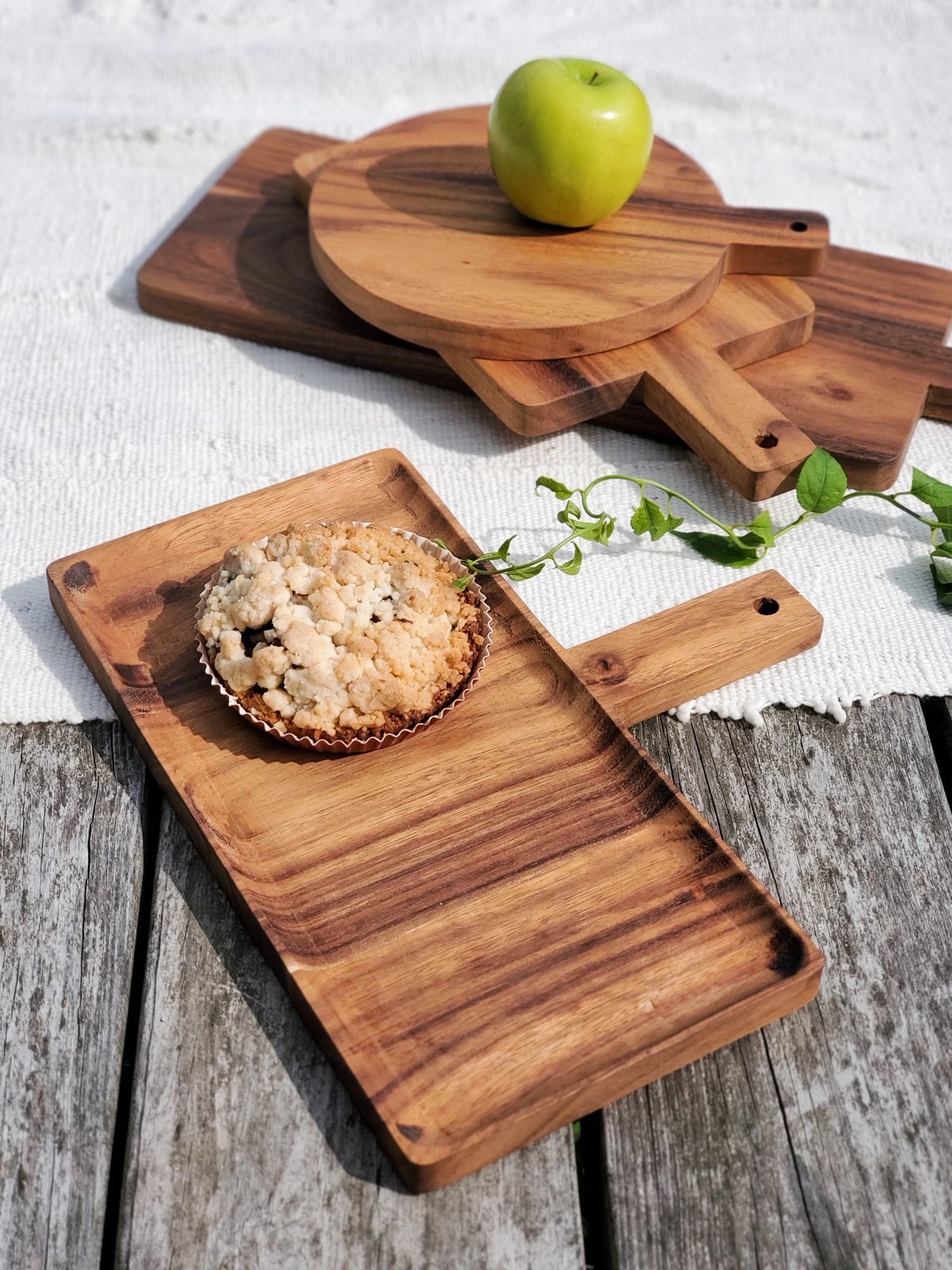 Handcrafted wooden serving tray made from Albizia hardwood, showcasing unique grain patterns and natural finish.