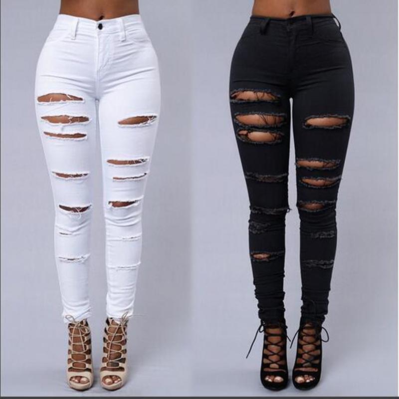 A pair of women's black denim skinny leggings with ripped decoration, showcasing a stylish and modern design.