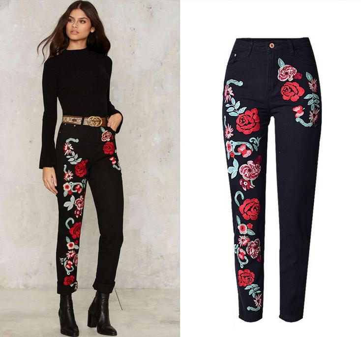 A pair of stylish women's black boyfriend jeans featuring intricate floral embroidery, designed for comfort and fashion.