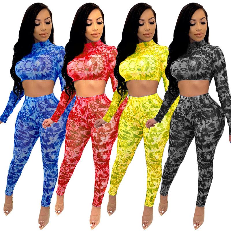 Women's summer tracksuit featuring a stylish printed crop top and full-length pants, designed for comfort and fashion.