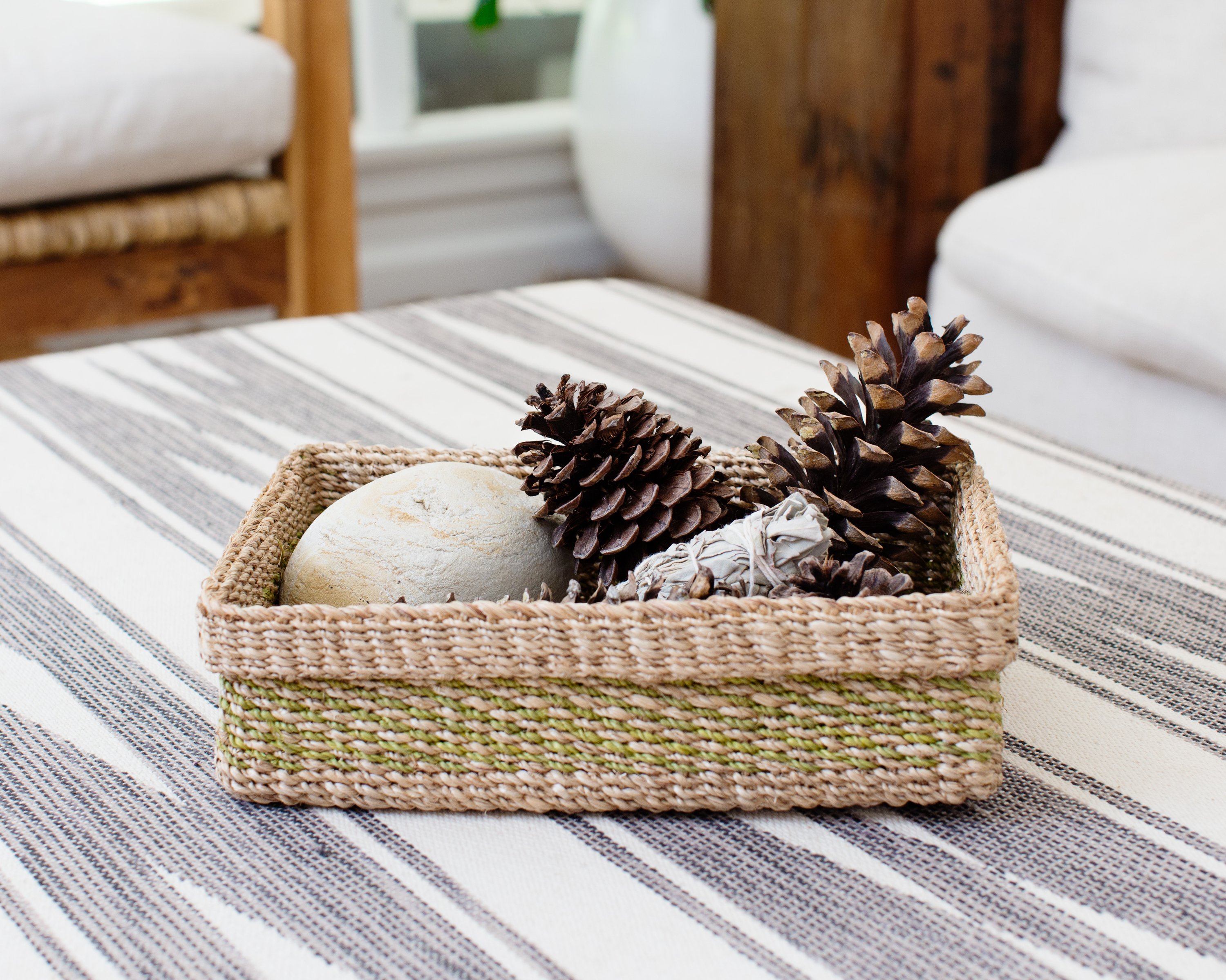 Handwoven Woven Catchall Storage Tray in vibrant lime green and natural colors, perfect for organizing small items in a stylish way.