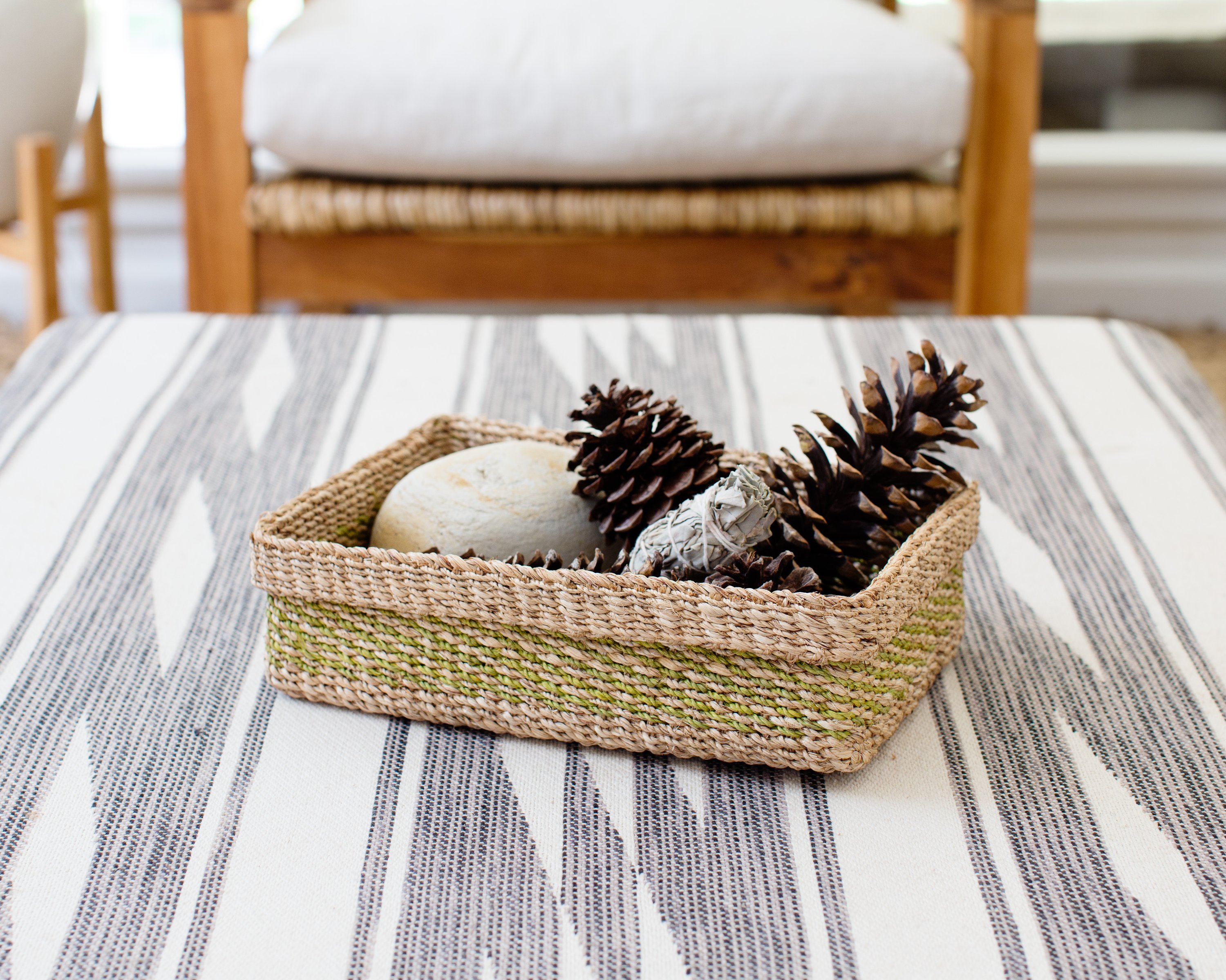 Handwoven Woven Catchall Storage Tray in vibrant lime green and natural colors, perfect for organizing small items in a stylish way.