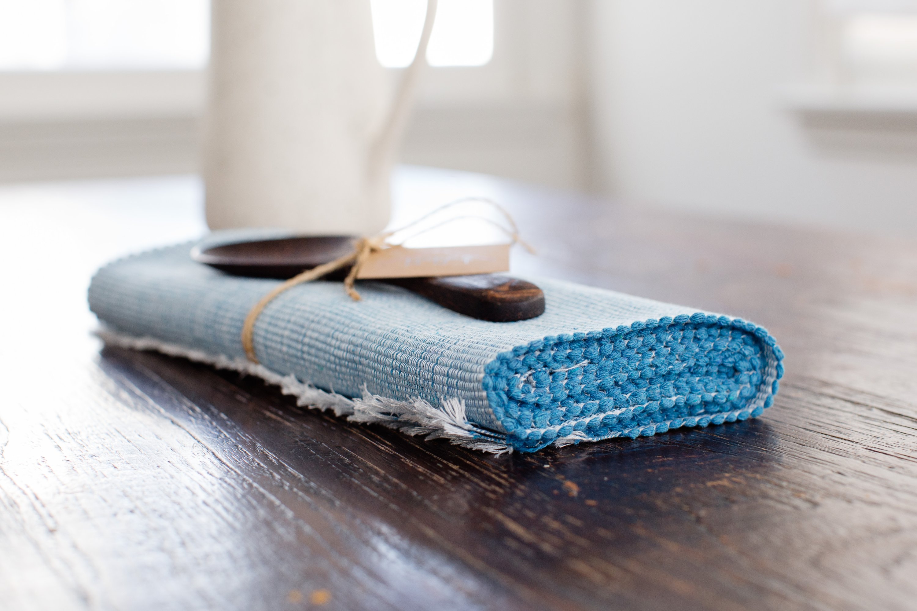 Handcrafted pastel blue woven cotton dining placemat featuring raised ribbed patterns, showcasing traditional Inabel fabric.