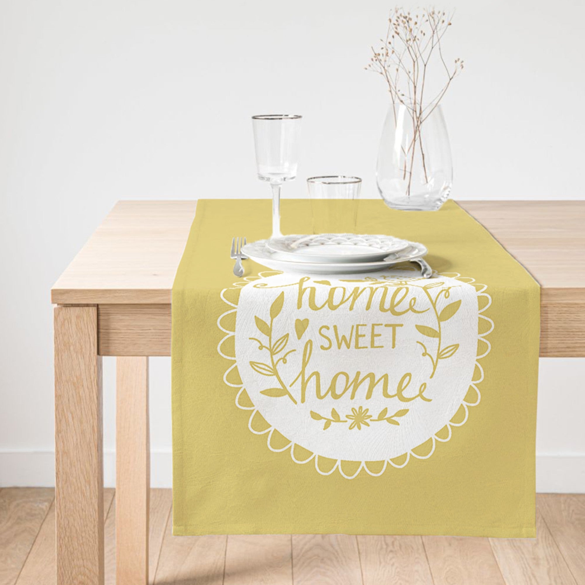 A vibrant yellow table runner with 'Home Sweet Home' printed design, showcasing vivid colors and high-quality fabric suitable for indoor and outdoor use.