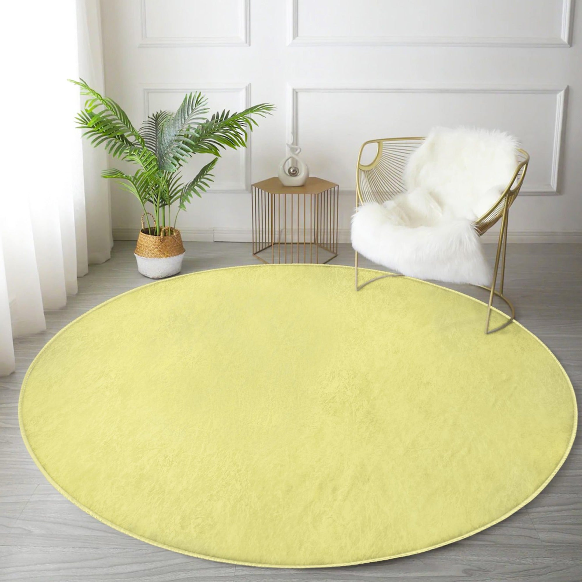 A vibrant yellow round rug made of soft velvet fabric, perfect for living room decor.