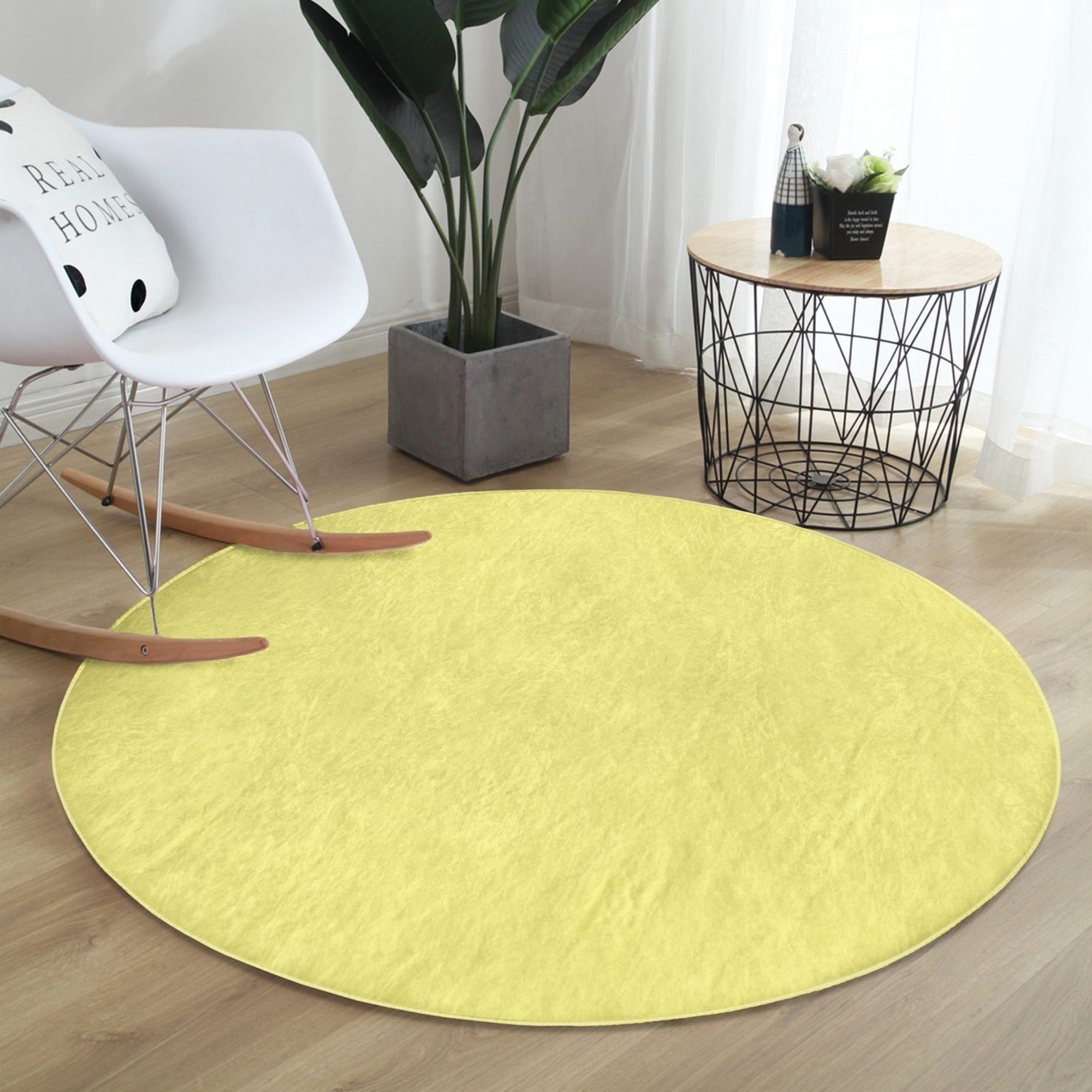 A vibrant yellow round rug made of soft velvet fabric, perfect for living room decor.