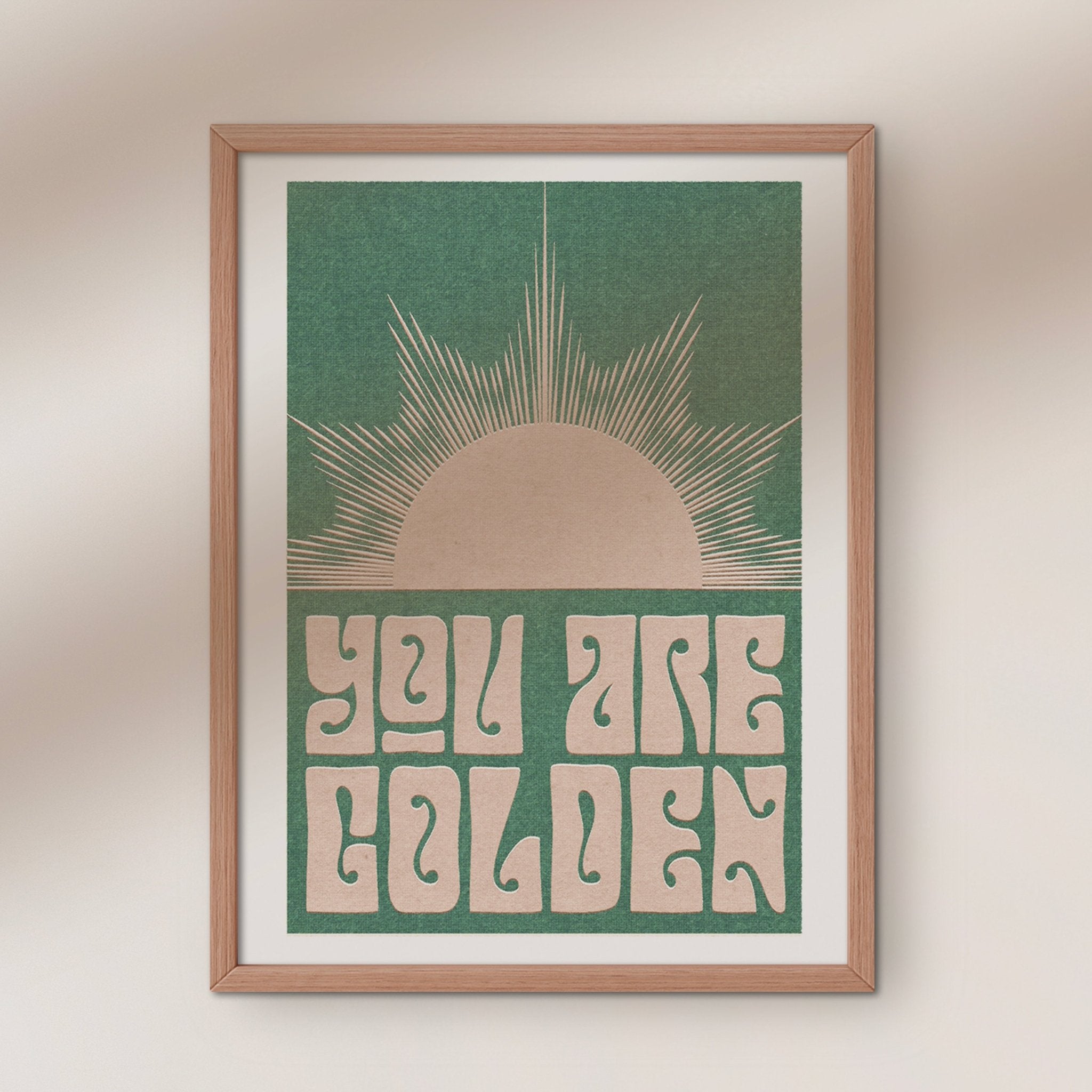 You Are Golden art print featuring retro typography and a minimal sun design in sepia and pink-green options.