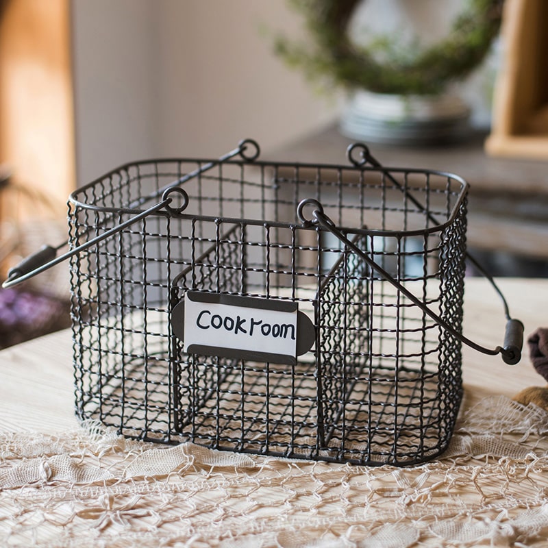 Zakka Multifunctional Wire Organizer Basket in dark gray and black, showcasing its compact design and sturdy handle.