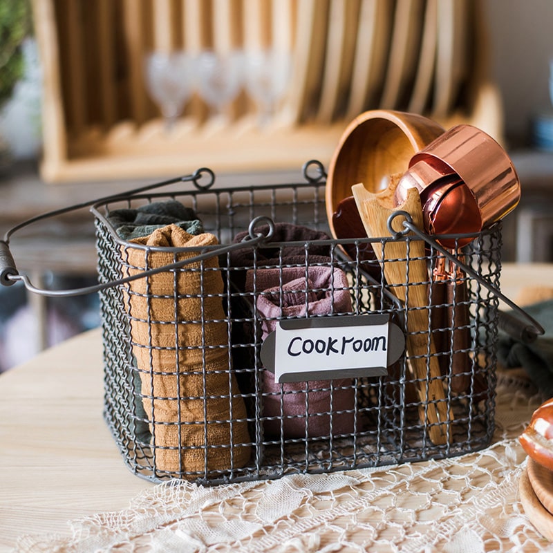 Zakka Multifunctional Wire Organizer Basket in dark gray and black, showcasing its compact design and sturdy handle.