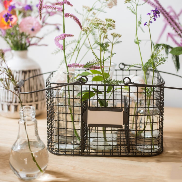 Zakka Multifunctional Wire Organizer Basket in dark gray and black, showcasing its compact design and sturdy handle.