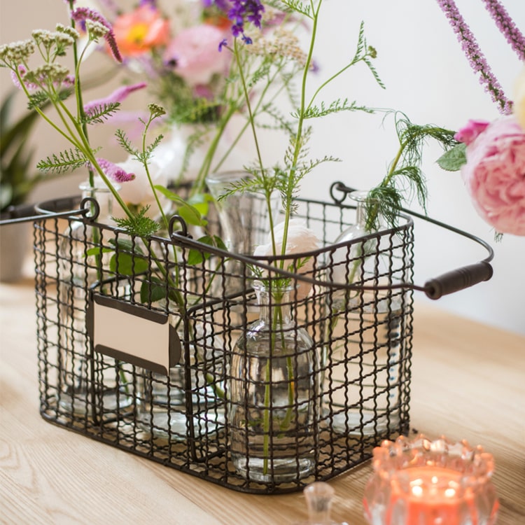 Zakka Multifunctional Wire Organizer Basket in dark gray and black, showcasing its compact design and sturdy handle.