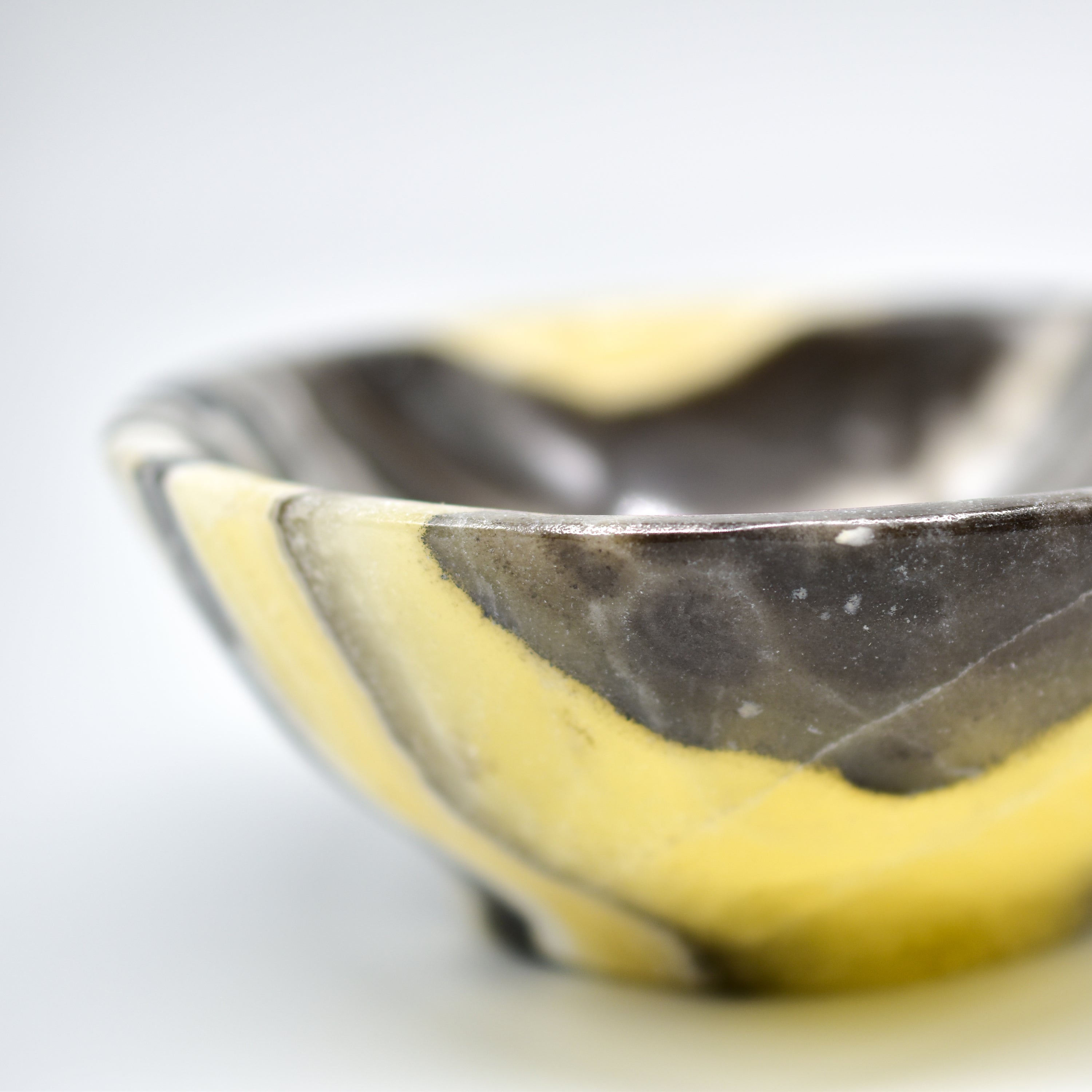 Handmade Zebra Onyx Circular Snack Bowls showcasing unique grey, gold, and cream bands, perfect for snacks or decorative use.