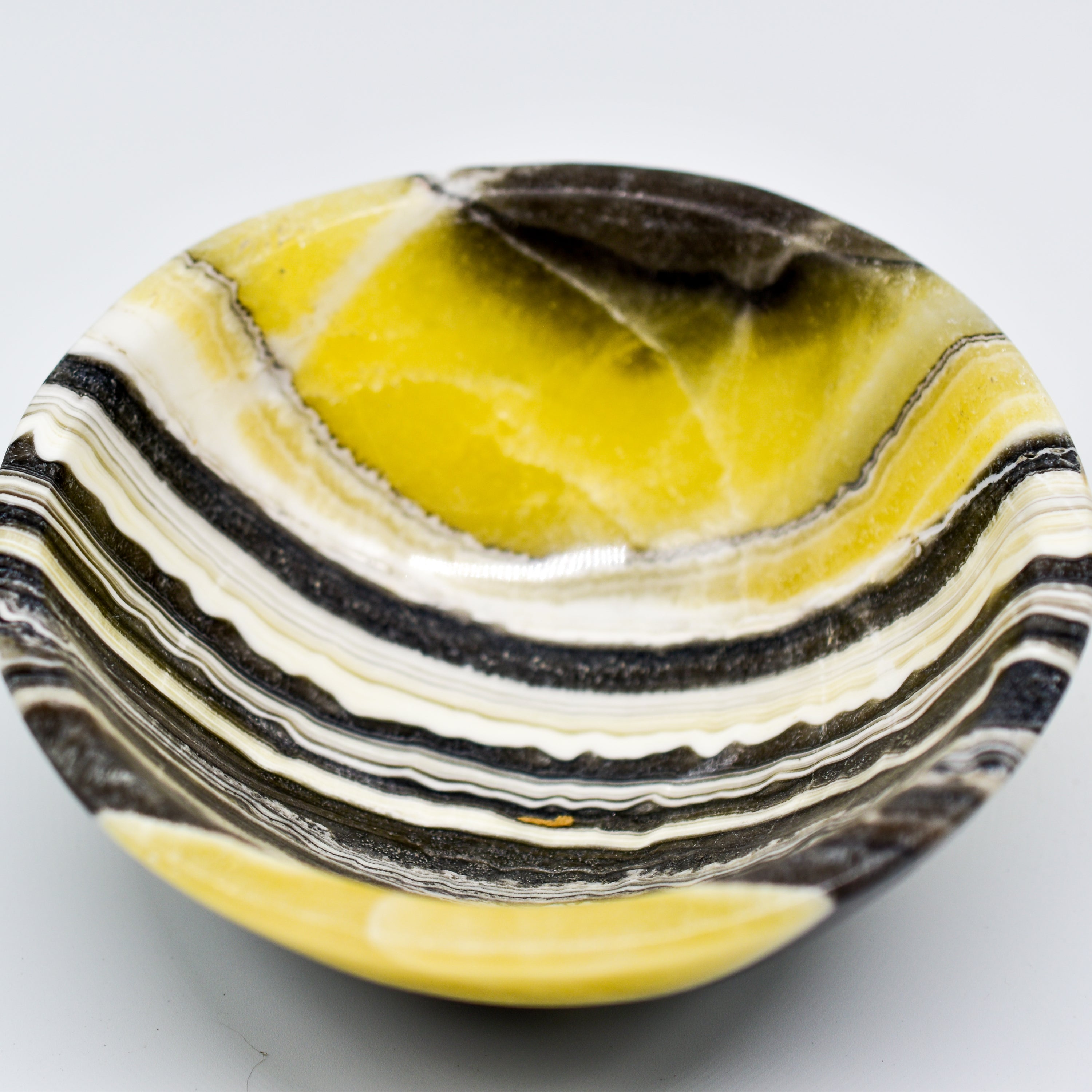 Handmade Zebra Onyx Circular Snack Bowls showcasing unique grey, gold, and cream bands, perfect for snacks or decorative use.