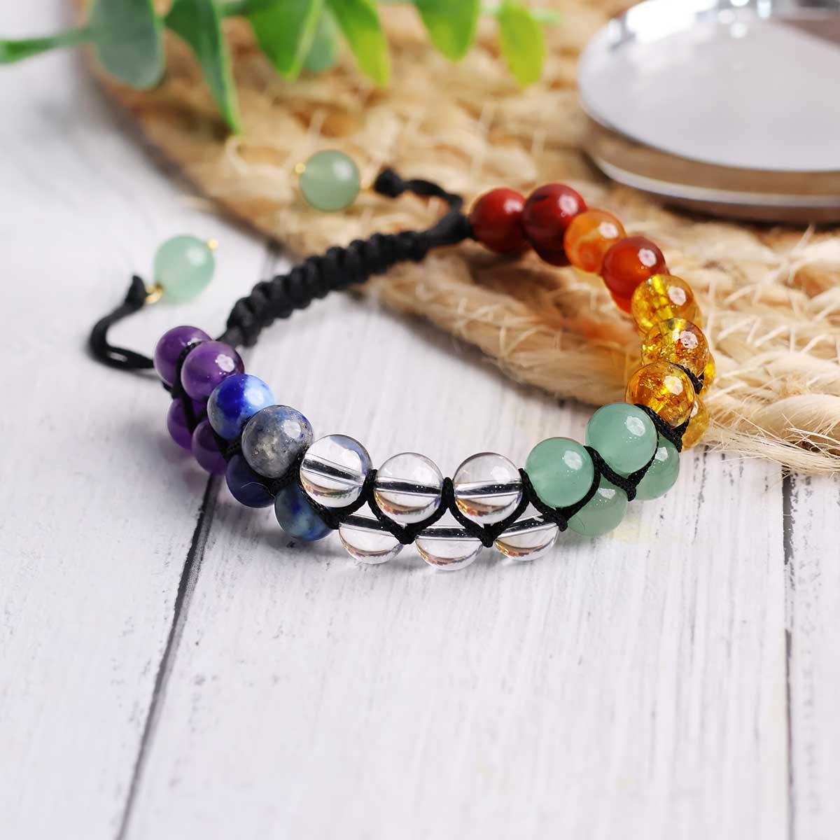 7 Chakra Adjustable Thread Bracelet with natural crystal round beads in vibrant colors representing each chakra.