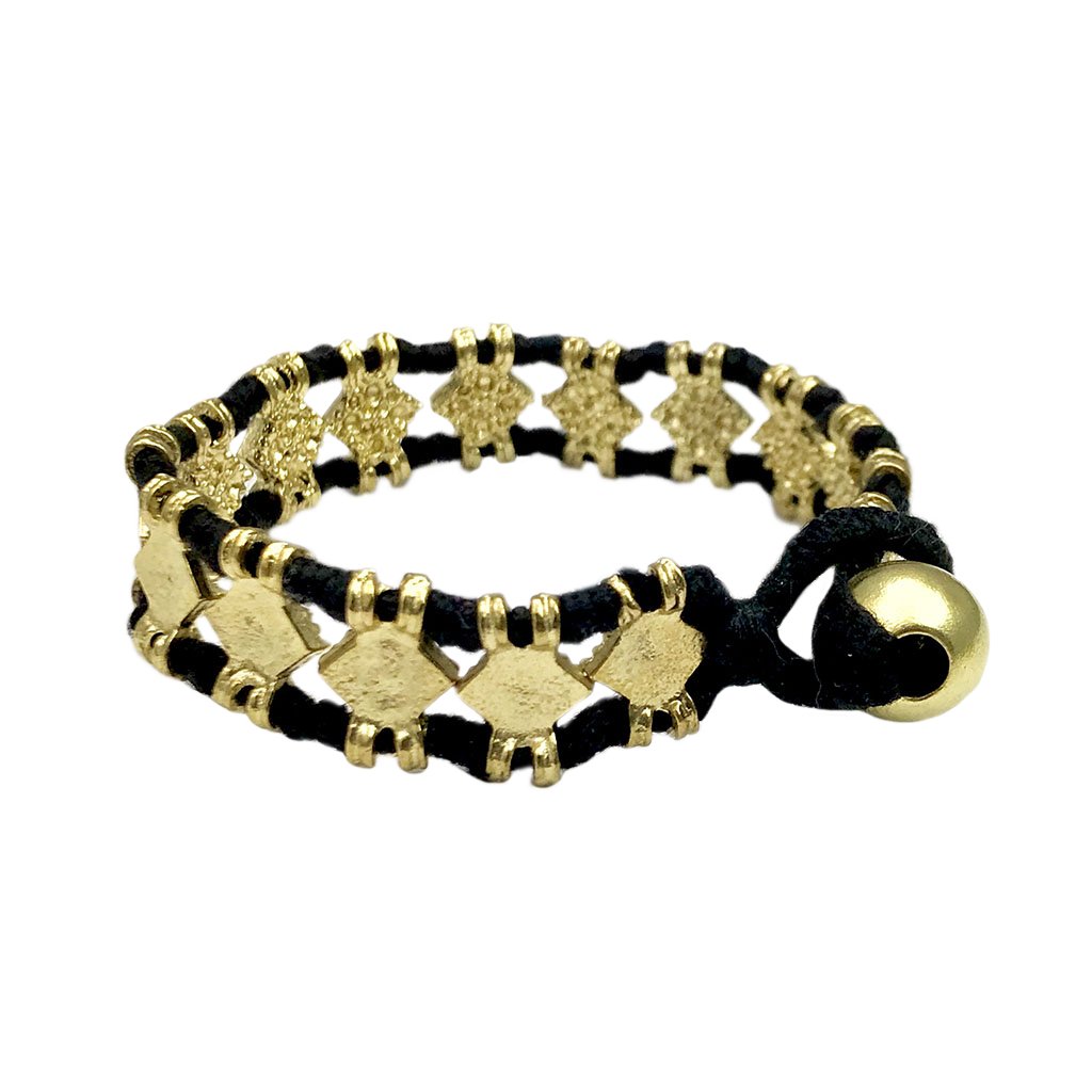 The Amara Bracelet featuring a bold diamond motif, handcrafted with intricate metal beads and cotton thread, showcasing traditional Indian craftsmanship.