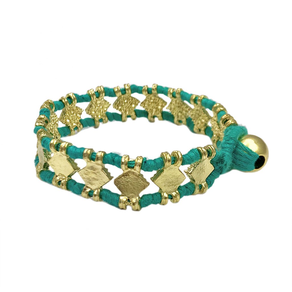 The Amara Bracelet featuring a bold diamond motif, handcrafted with intricate metal beads and cotton thread, showcasing traditional Indian craftsmanship.