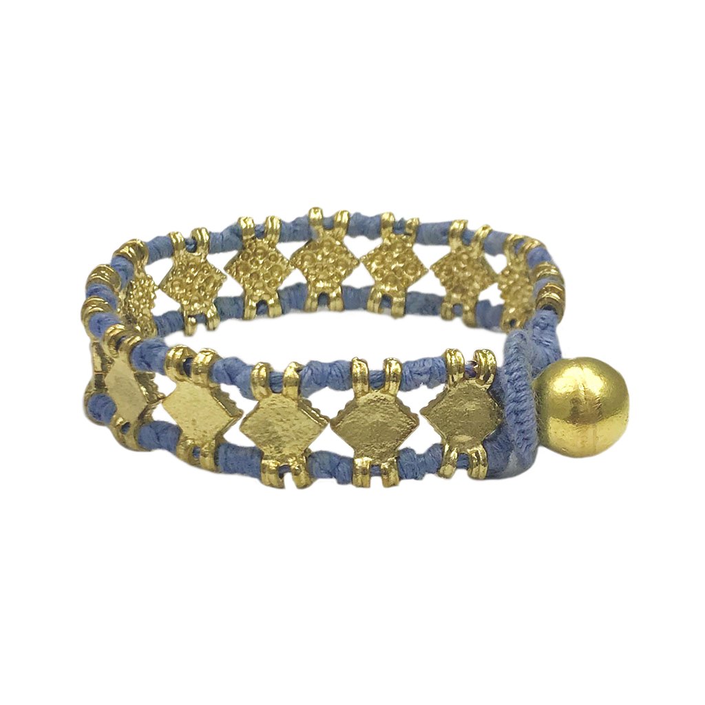 The Amara Bracelet featuring a bold diamond motif, handcrafted with intricate metal beads and cotton thread, showcasing traditional Indian craftsmanship.