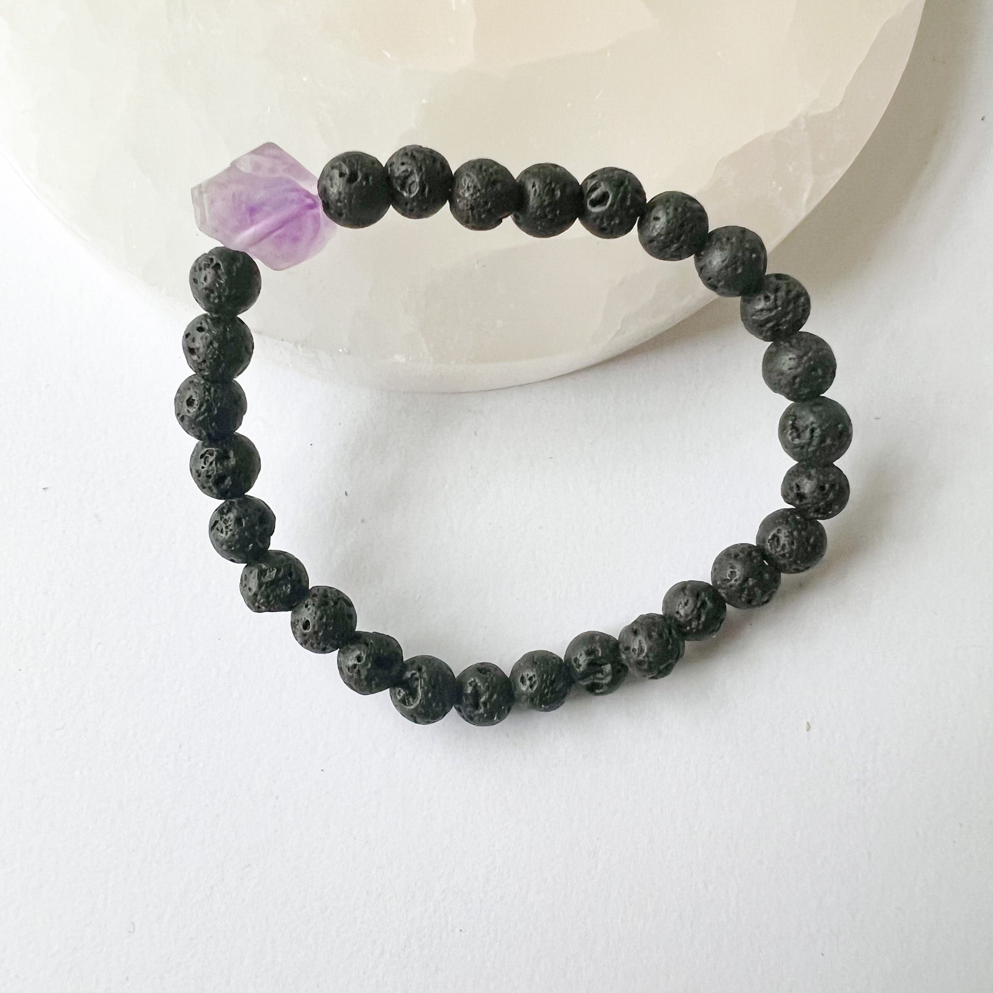 Amethyst and Lava Stone Diffuser Bracelet showcasing natural lava beads and raw amethyst, perfect for aromatherapy.