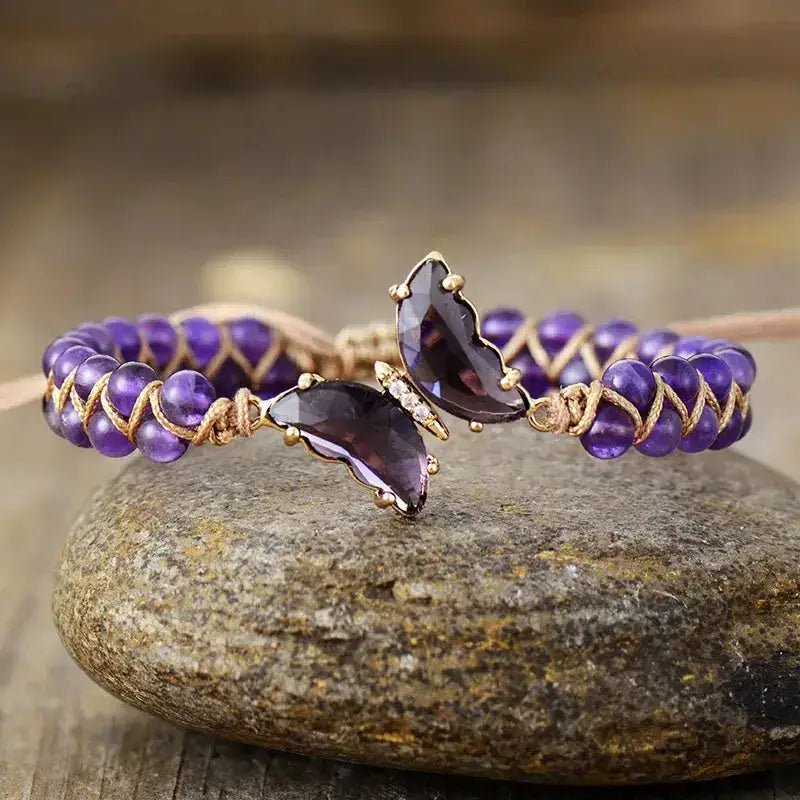 A beautifully handcrafted Amethyst Crystal Butterfly Bracelet featuring genuine amethyst stones and a delicate butterfly design.