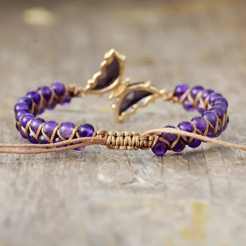 A beautifully handcrafted Amethyst Crystal Butterfly Bracelet featuring genuine amethyst stones and a delicate butterfly design.